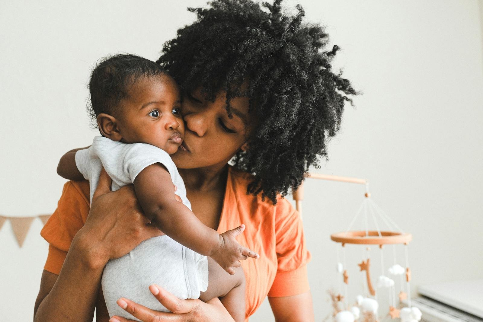 Little Child Kissing Mother in Golden Crown